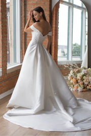 Boady Wtoo by Watters The Boady gown features a timeless yet modern silhouette with detachable sleeves and an exaggerated train in our new Majesty Mikado. The dramatic bodice seaming, and draped sleeve detail add visual interest while still being easy to wear for a modern classic bridal moment.