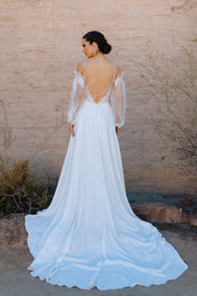 Slip on the sheer sleeves or leave Regan as a strappy A-line gown perfect for an outdoor wedding.